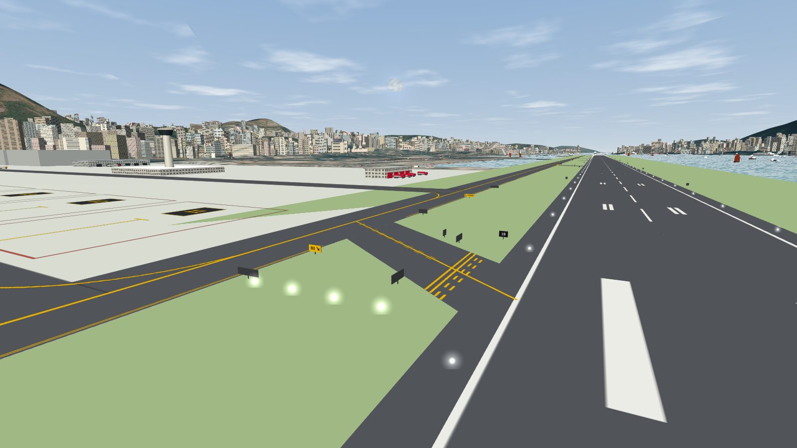 Looking along the runway edge toward the apron, with the B1 link taxiway, its yellow markings and several small signs.