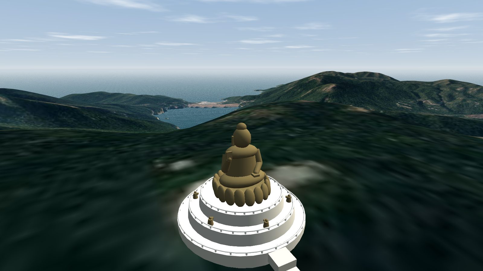 A seated bronze Buddha on a lotus throne atop a white three-tier round altar on a green hilltop, with a long flight of steps leading down.