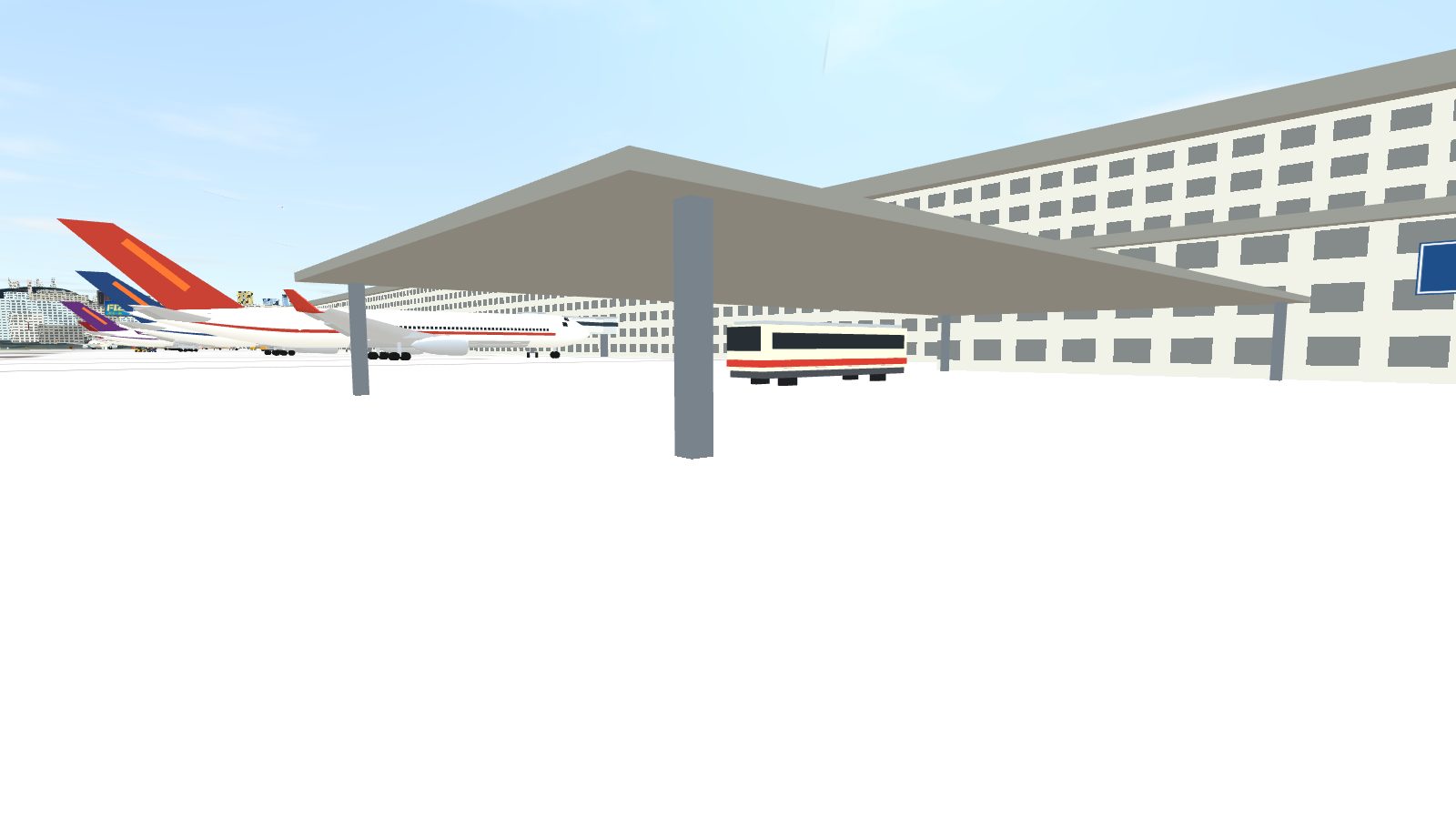 The bus gate canopy beside the pier, with a bus loading under it.