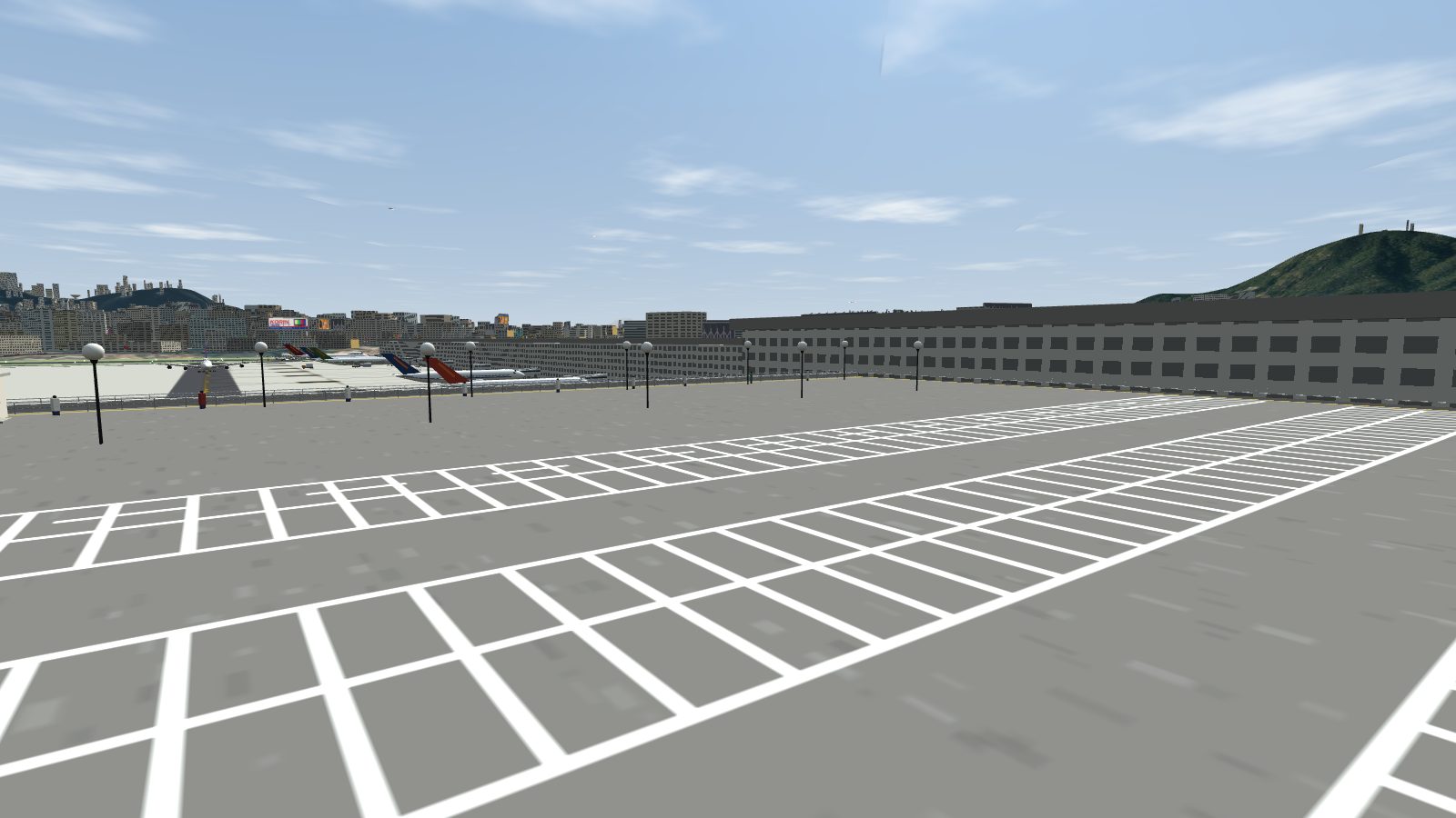 White parking bay lines in rows across the car park roof, with globe lamps and the apron beyond.