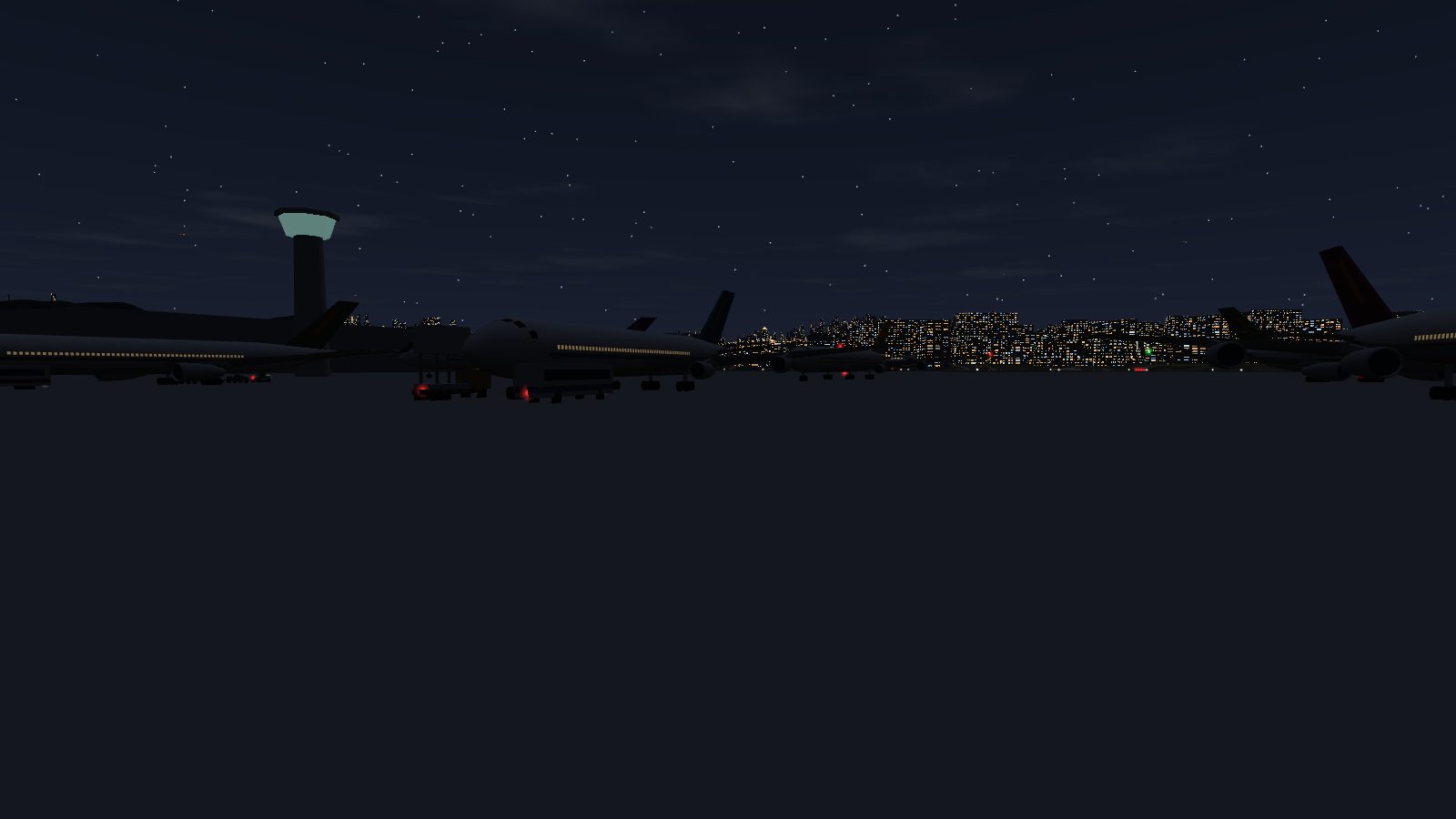 The apron at night with tail lamps and beacons lit.