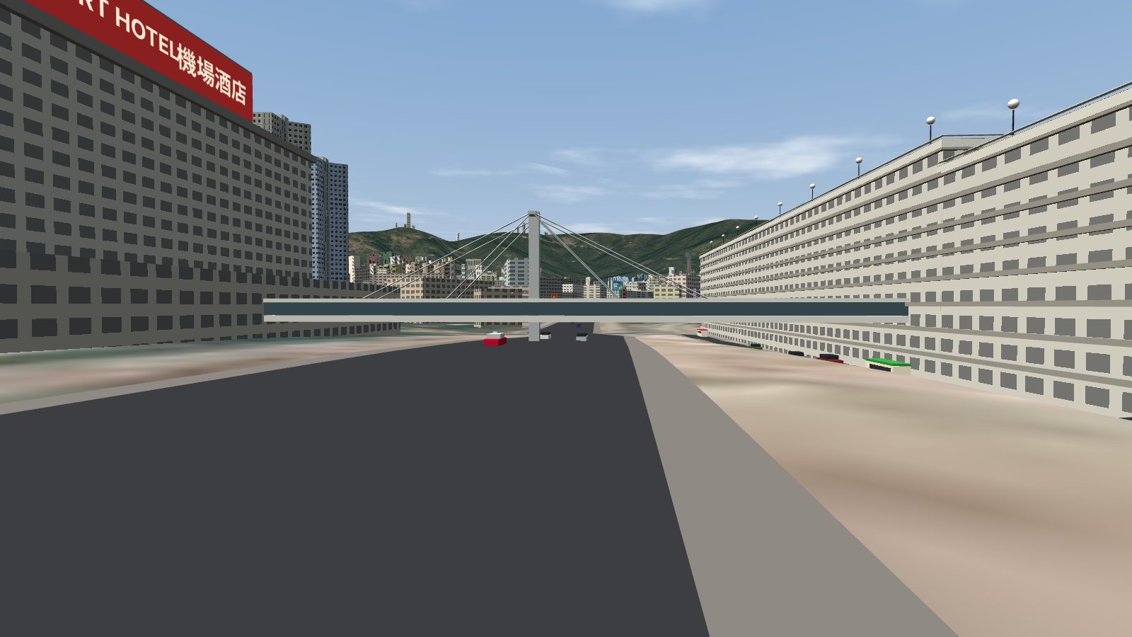 Looking along Prince Edward Road East: the hotel on the left, the car park on the right and the footbridge between them, hung from a central column by cable stays.
