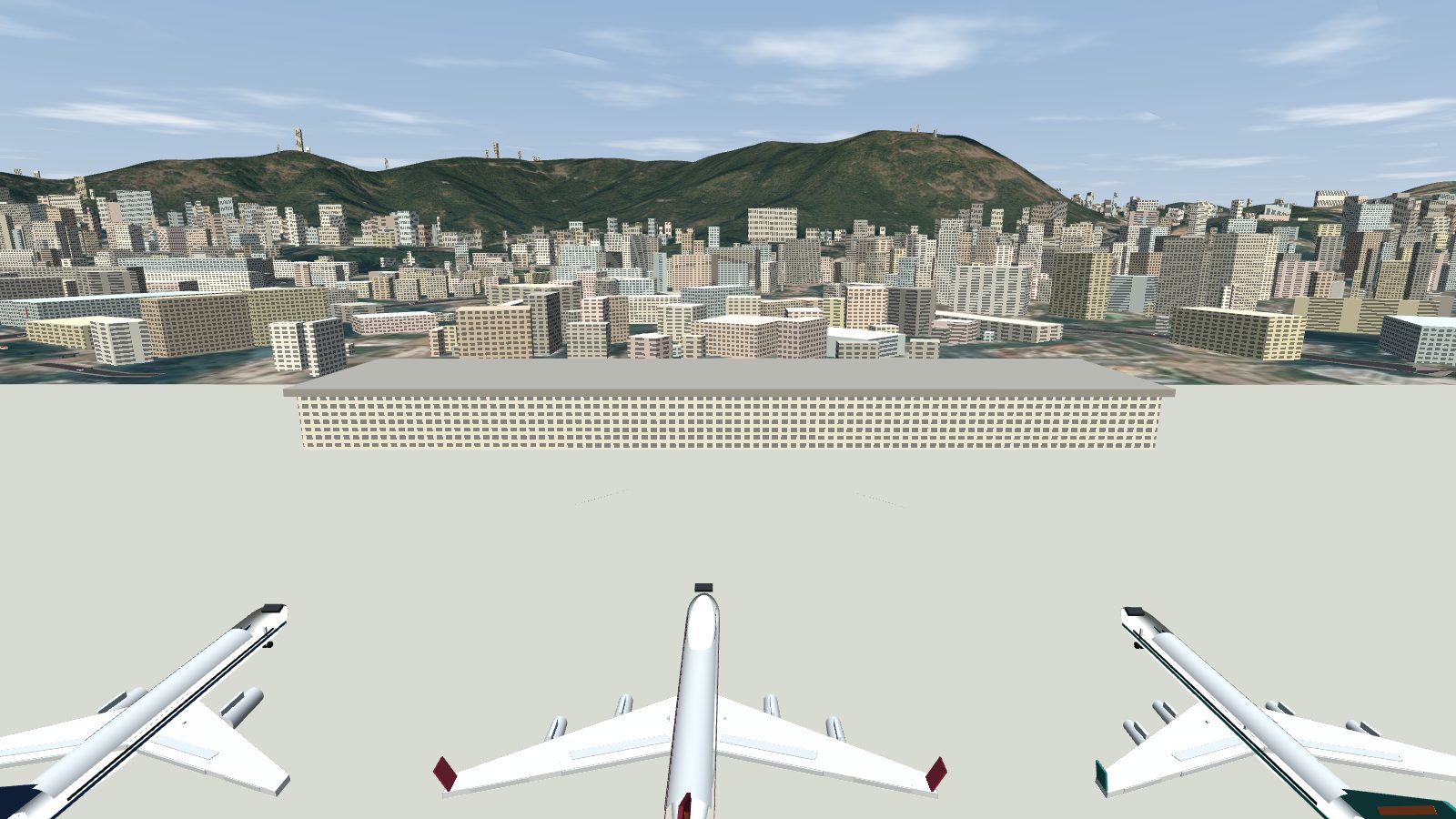 The Kai Tak terminal behind parked jets on the apron.