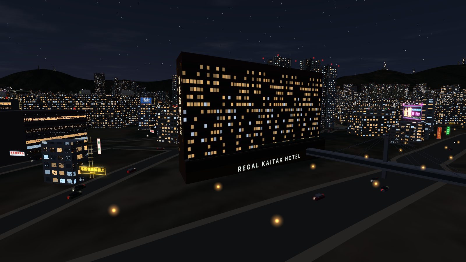 The hotel at night: scattered warm and cool lit windows, the hotel name glowing across the podium, the footbridge in the dark.