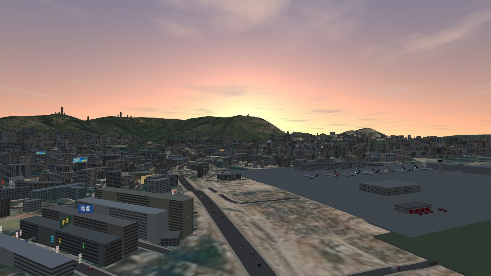 Sunrise over the hills east of Kowloon, with a warm glow along the horizon.