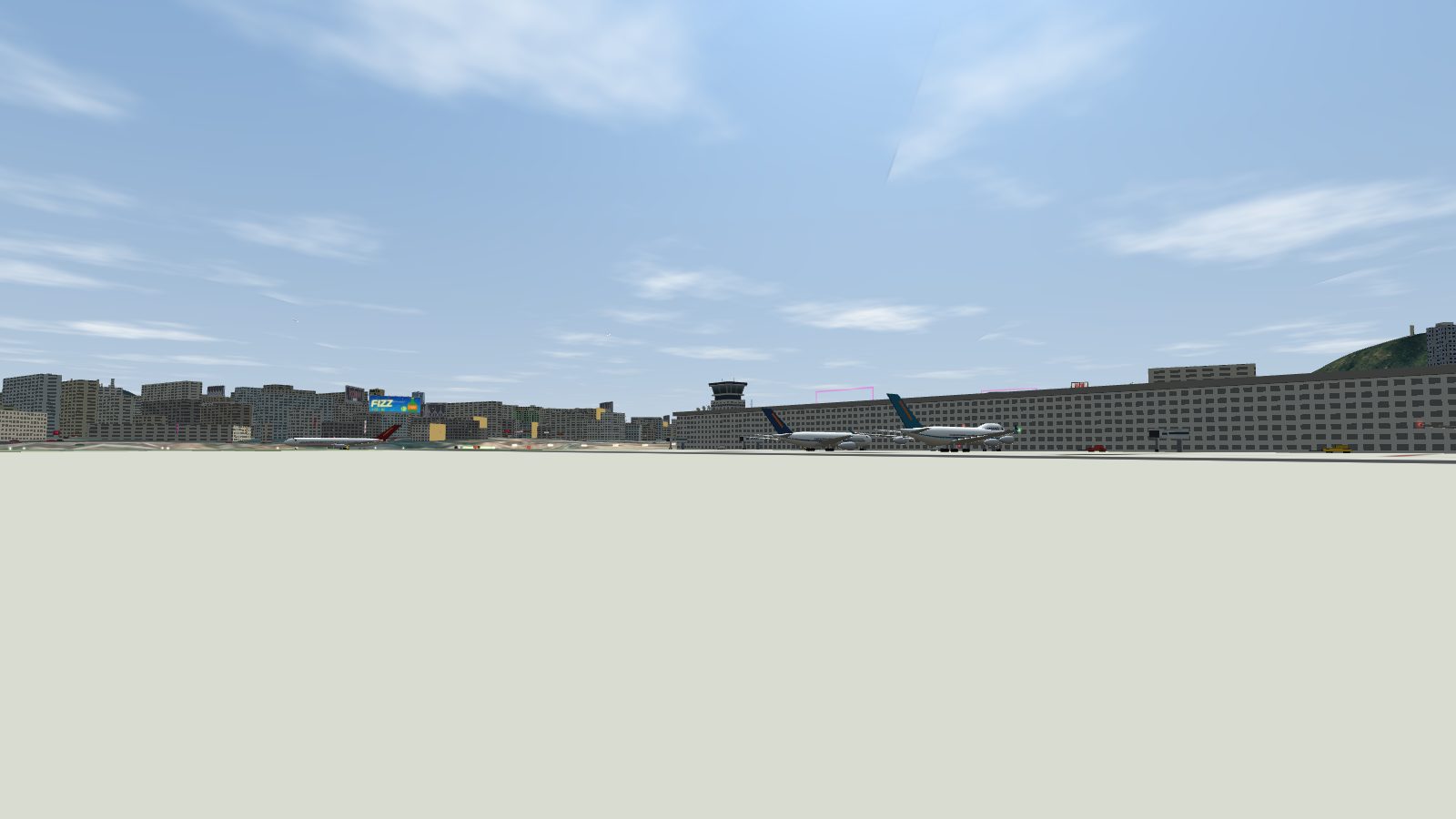 The terminal seen from the apron, with the control tower above the roofline.