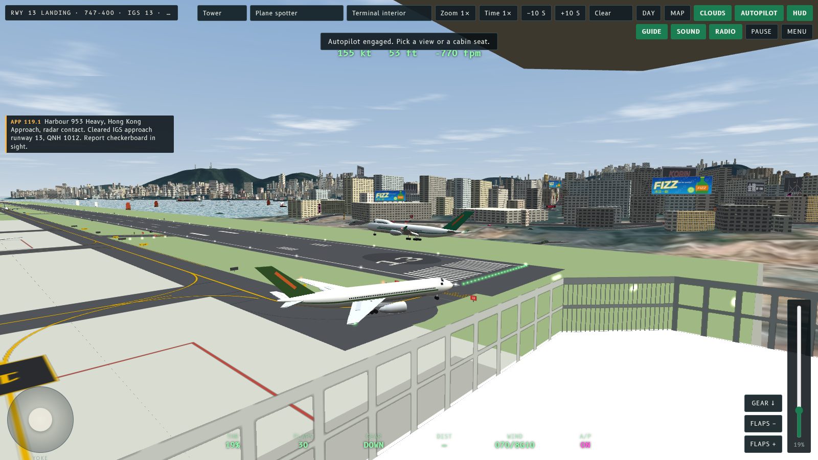 The Tower view looking down on an airliner on the taxiway, with the runway and the harbour beyond.